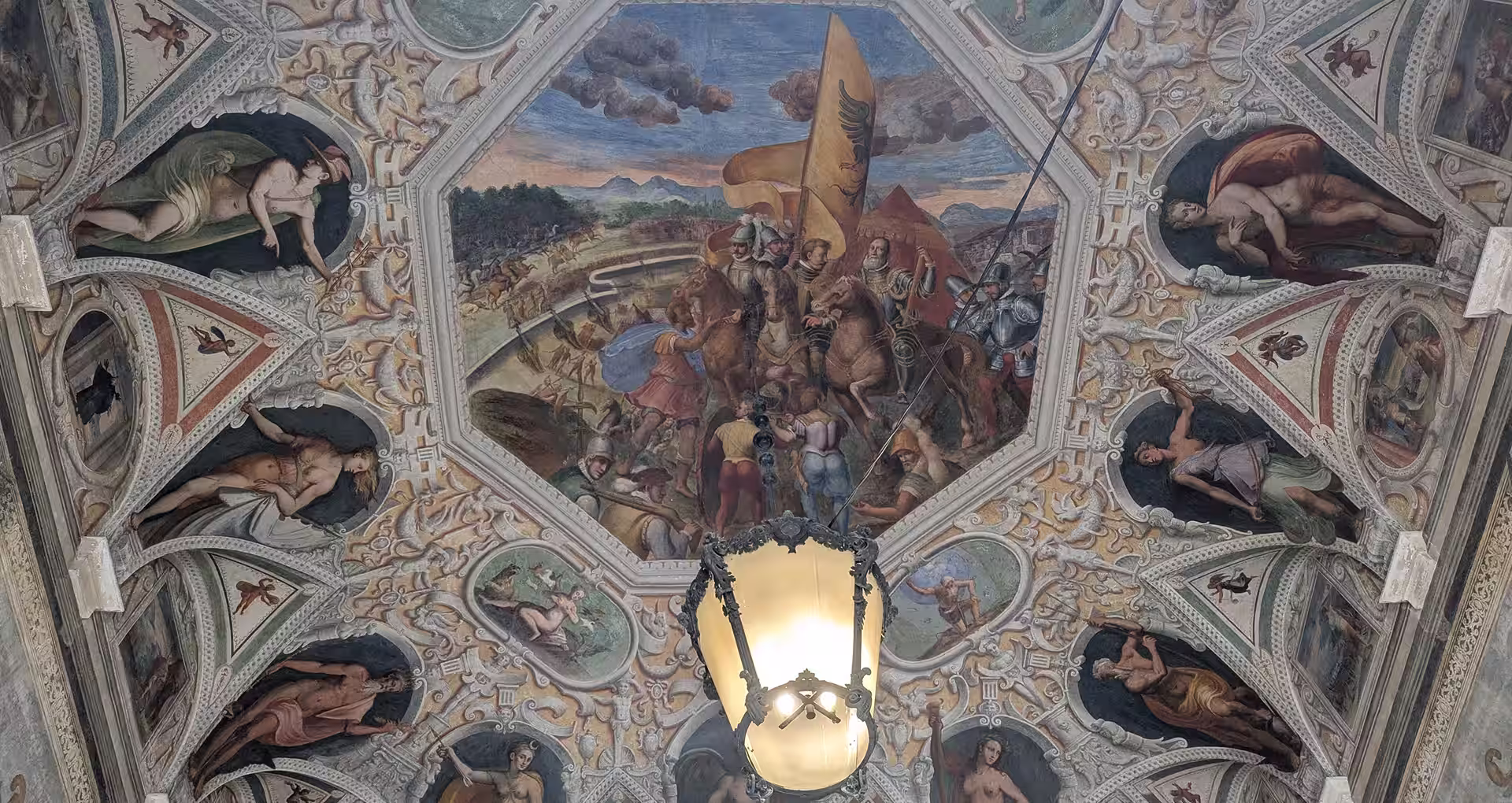 Frescoed ceiling with a battle scene inside a Rolli palace on Via Garibaldi, Genoa